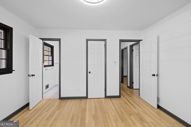 unfurnished bedroom with light hardwood / wood-style flooring