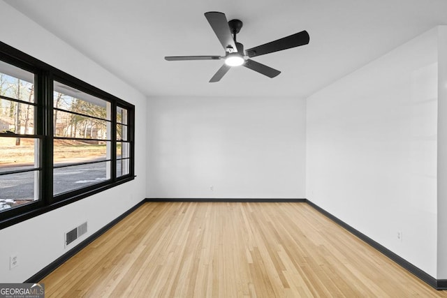 unfurnished room featuring ceiling fan and light hardwood / wood-style flooring