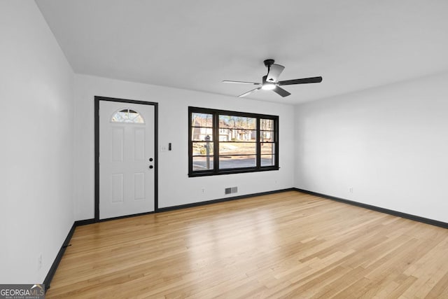 entrance foyer featuring light wood-type flooring and ceiling fan