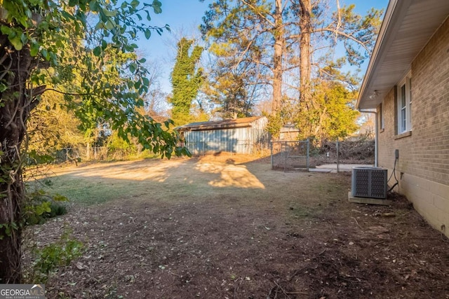 view of yard with a shed and cooling unit