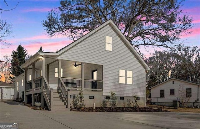 view of front of property featuring ceiling fan and covered porch