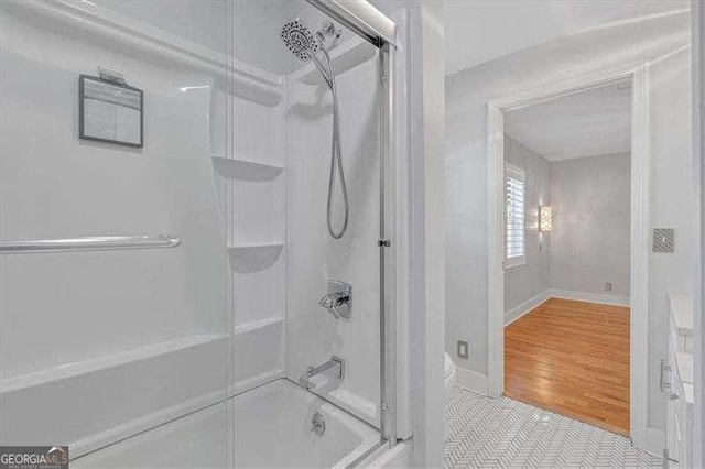 bathroom with enclosed tub / shower combo and tile patterned floors