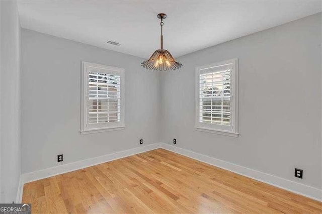 spare room featuring hardwood / wood-style floors