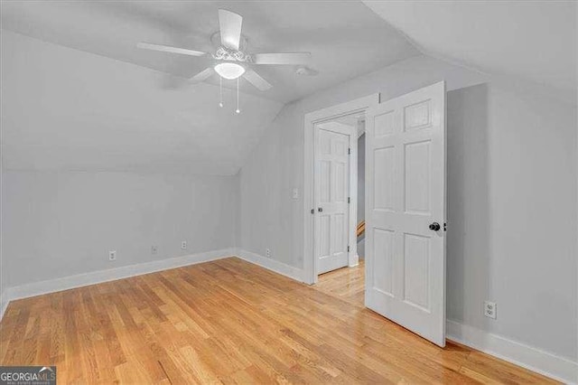 additional living space featuring ceiling fan, lofted ceiling, and light hardwood / wood-style floors