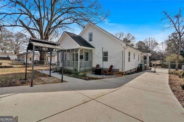 view of side of home with a sunroom