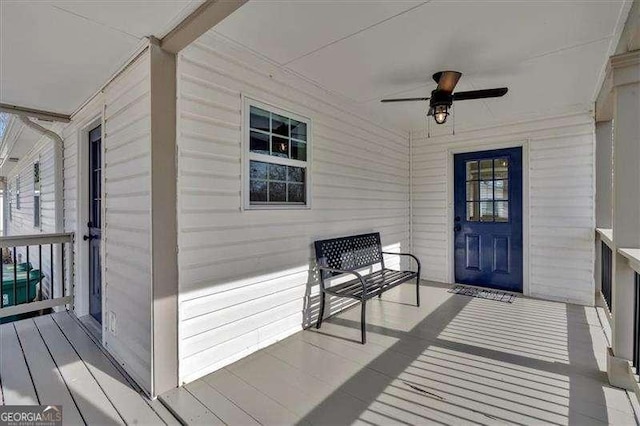 doorway to property with ceiling fan and covered porch