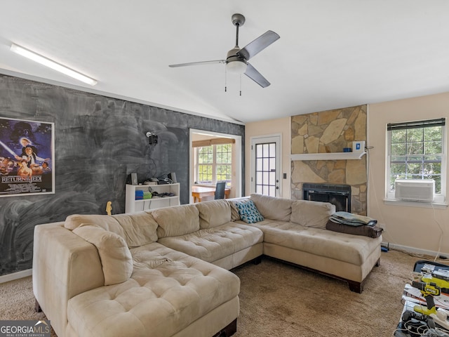 living room with ceiling fan, cooling unit, a fireplace, and carpet flooring