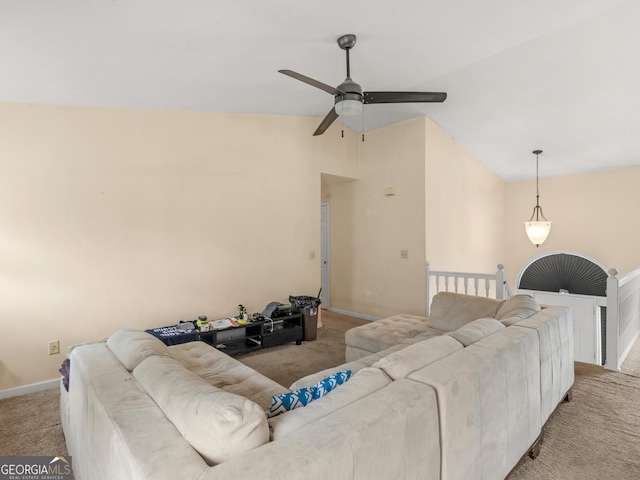 living room with ceiling fan, light carpet, and lofted ceiling