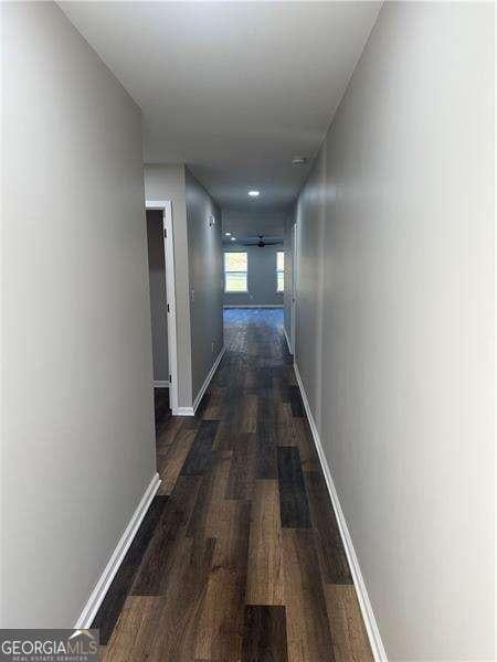 hallway featuring dark hardwood / wood-style floors