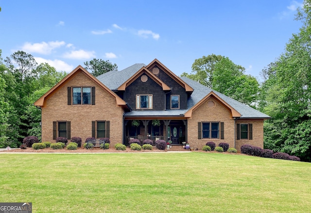 craftsman-style house with covered porch and a front yard