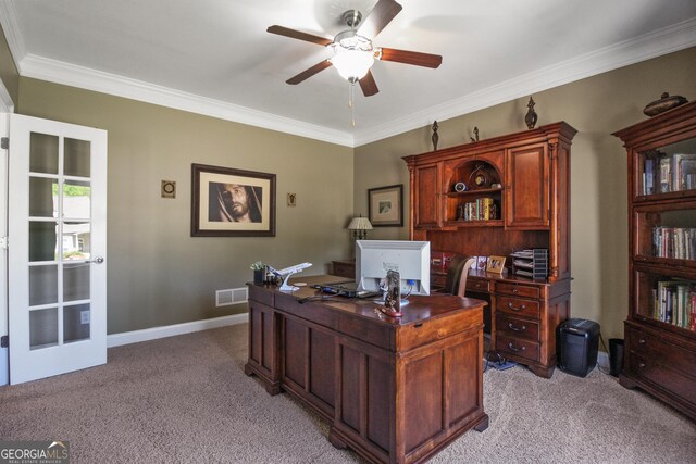 carpeted home office featuring ceiling fan and crown molding