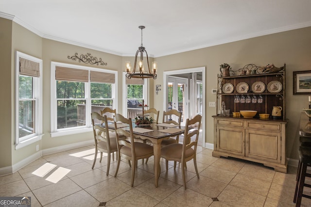 dining area with light tile patterned floors, crown molding, and a chandelier