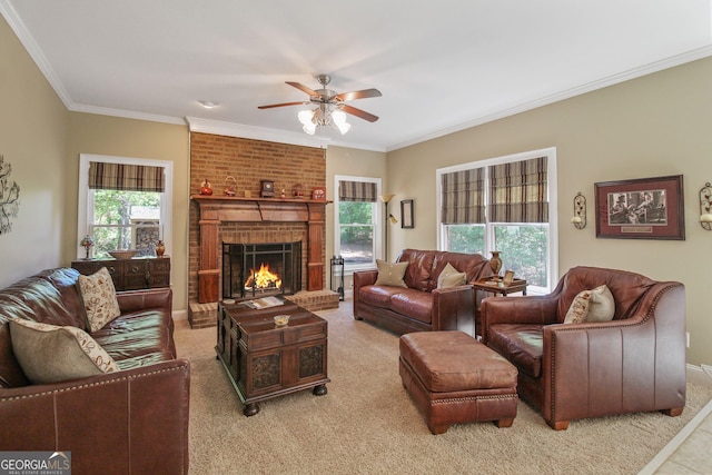 living room featuring light carpet, a brick fireplace, crown molding, and ceiling fan