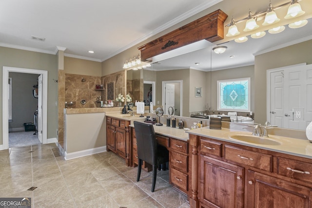 bathroom with a tile shower, vanity, and crown molding