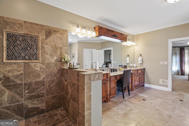 bathroom featuring vanity, a shower, and crown molding