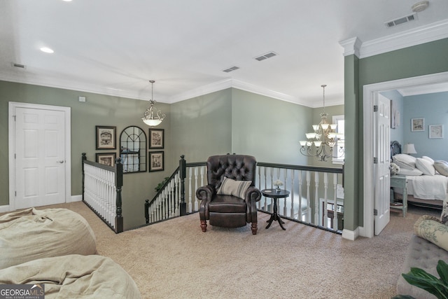 sitting room with carpet, a notable chandelier, and ornamental molding