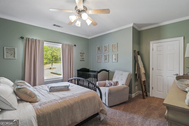 carpeted bedroom with ceiling fan and crown molding