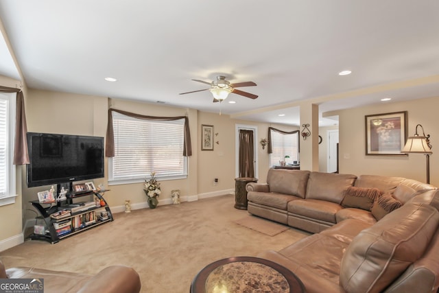 living room featuring ceiling fan and light carpet