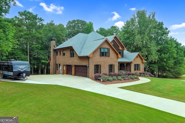 view of front facade with a front yard and a garage