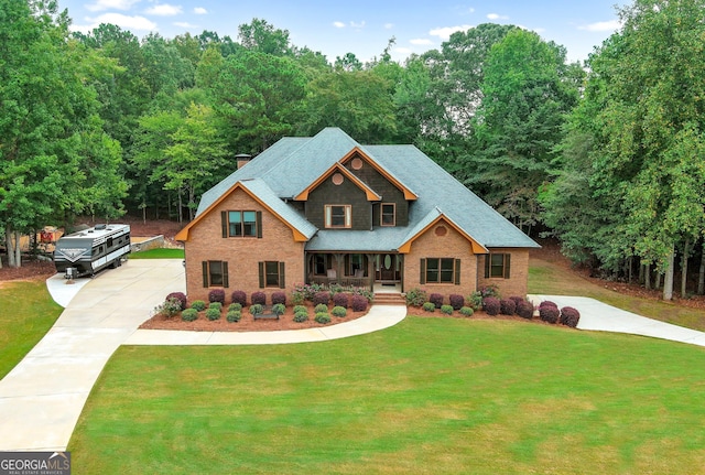 craftsman house featuring a front lawn and covered porch