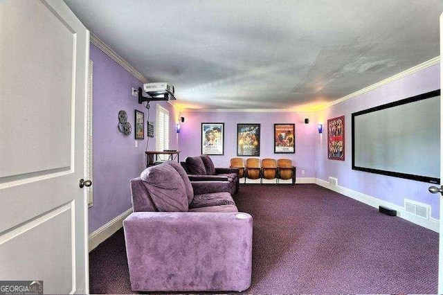 carpeted cinema featuring crown molding