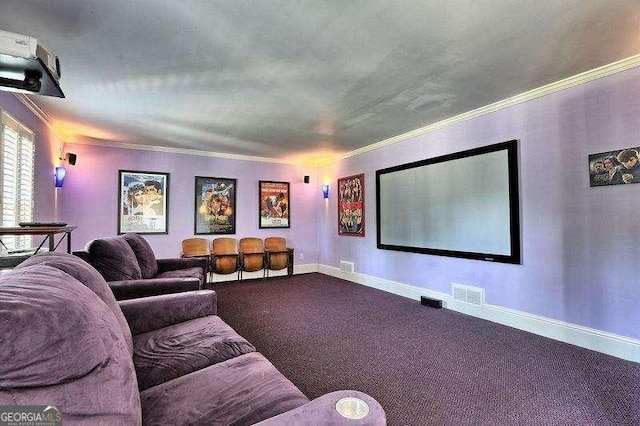 home theater room featuring crown molding and carpet flooring