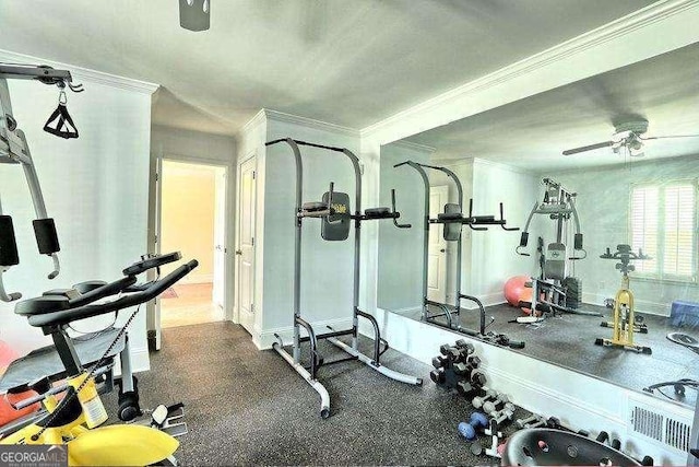 workout area featuring ceiling fan and ornamental molding