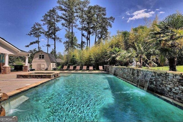 view of pool featuring a fenced in pool, a fireplace, and a patio