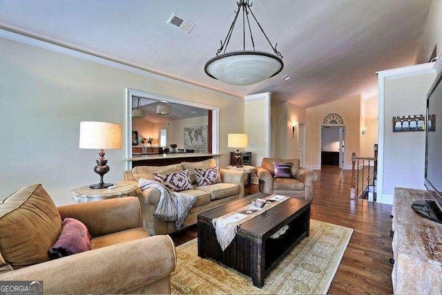 living room with lofted ceiling and dark hardwood / wood-style floors