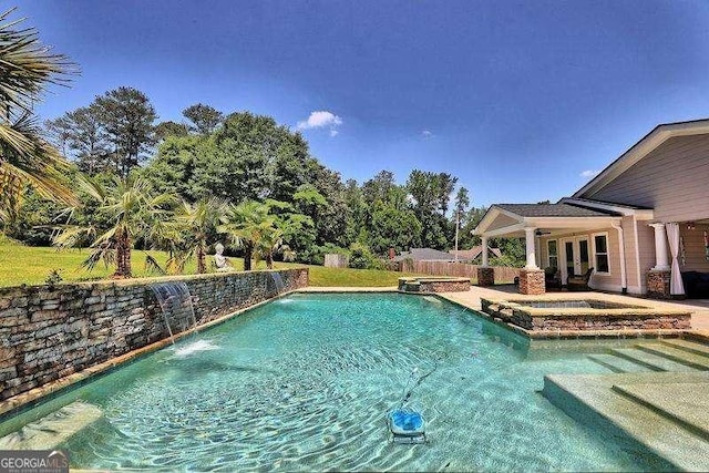 view of swimming pool featuring french doors, fence, a patio area, and a pool with connected hot tub