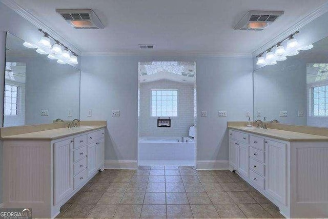 bathroom with a bath, ornamental molding, and vanity