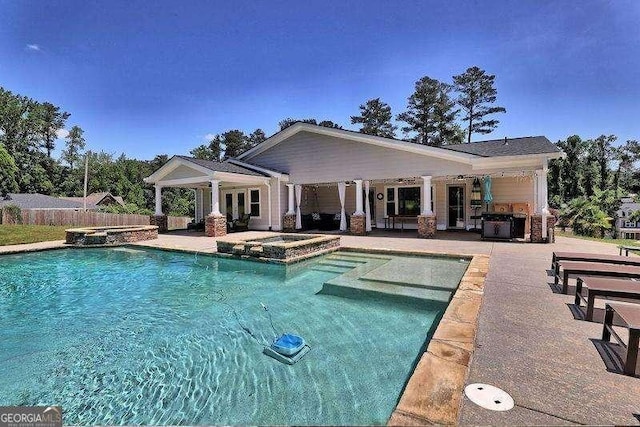 pool featuring an in ground hot tub, fence, french doors, and a patio