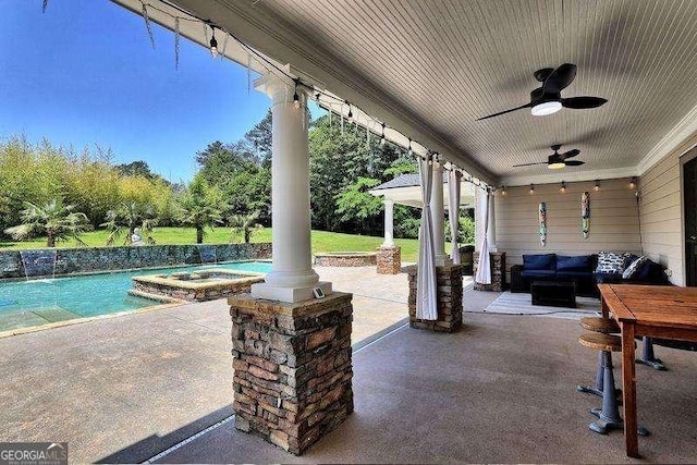 view of patio featuring outdoor lounge area, a ceiling fan, an outdoor pool, and a hot tub