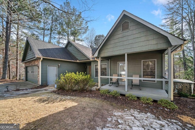 view of front facade featuring a porch and a garage