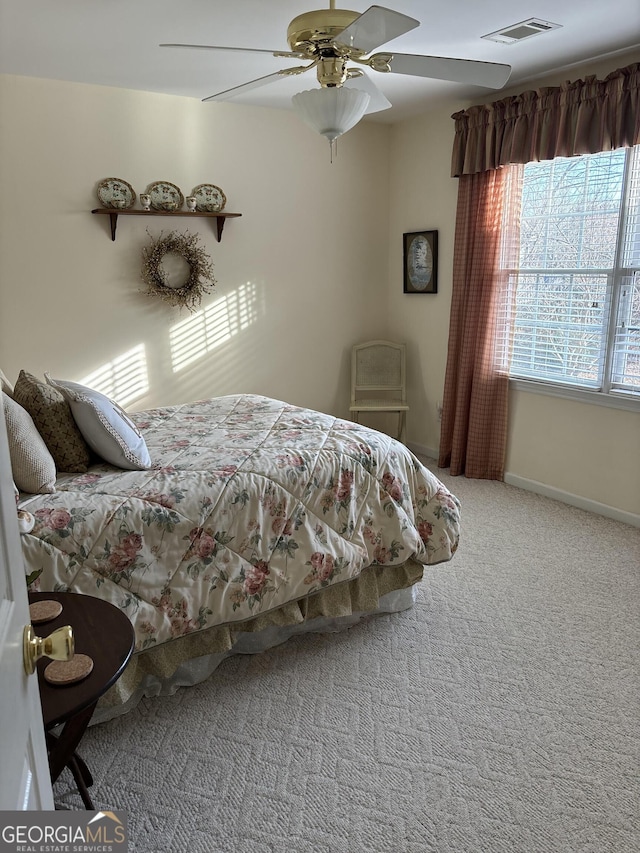 bedroom featuring ceiling fan and carpet flooring