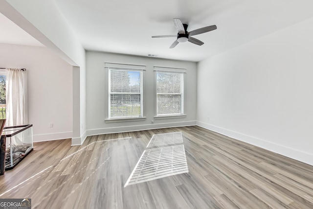 unfurnished room with light hardwood / wood-style floors and ceiling fan