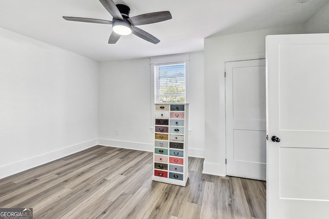 interior space with ceiling fan and light hardwood / wood-style flooring