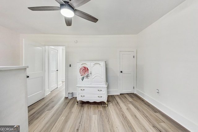 unfurnished bedroom featuring light wood-type flooring and ceiling fan