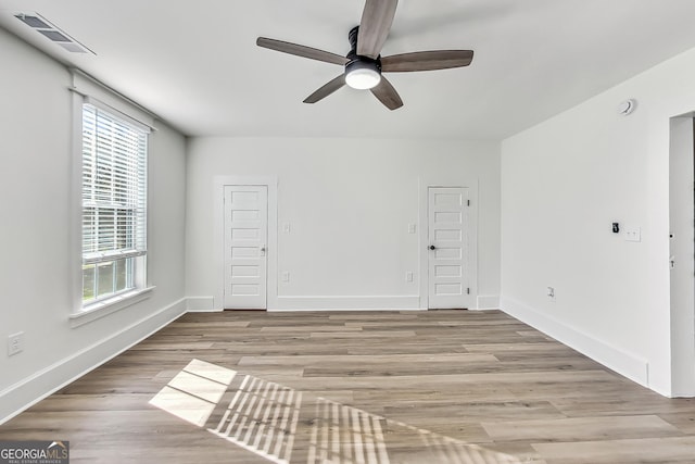 unfurnished room featuring ceiling fan and light hardwood / wood-style flooring