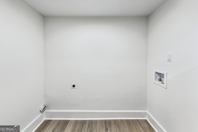 laundry room with hardwood / wood-style floors, hookup for a washing machine, and hookup for an electric dryer