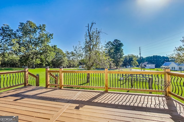 wooden terrace with a yard