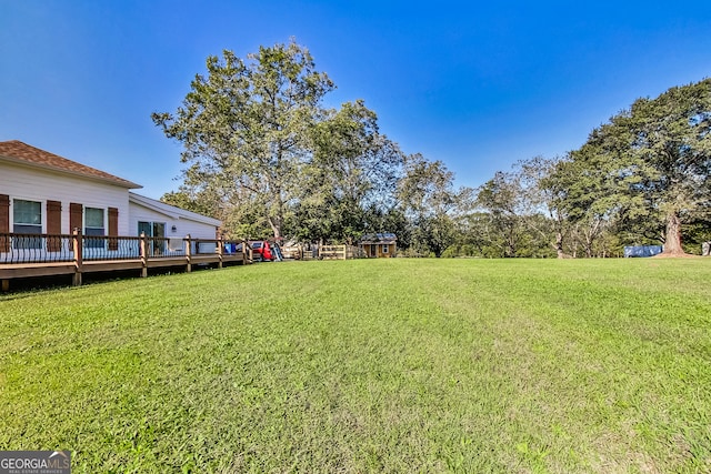 view of yard with a deck