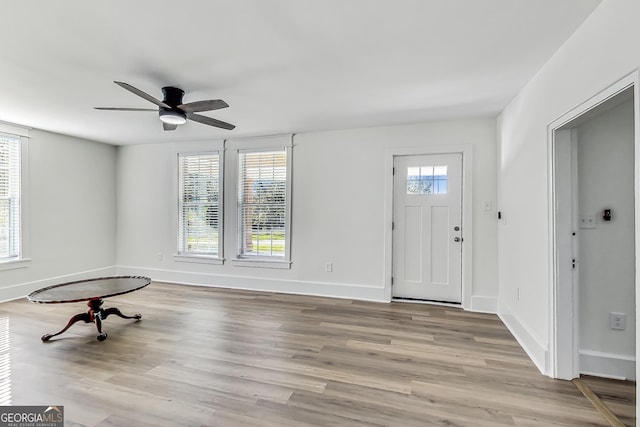 entryway with ceiling fan and light hardwood / wood-style flooring