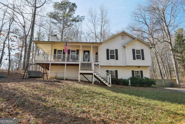 view of front of home featuring a porch and a front yard