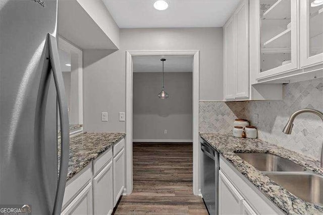 kitchen with white cabinets, sink, and stainless steel appliances