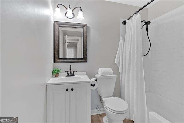 full bathroom featuring toilet, vanity, and shower / tub combo with curtain