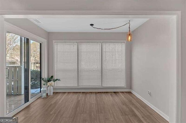 empty room with wood-type flooring