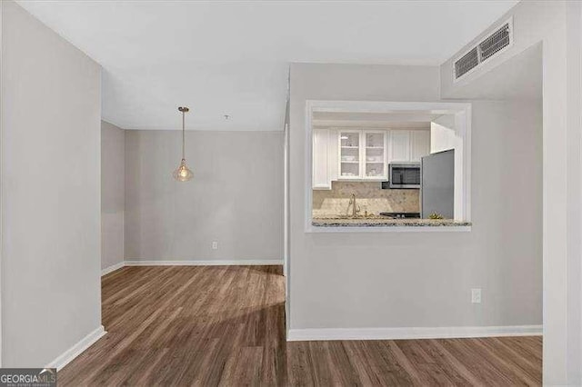 interior space with dark wood-type flooring