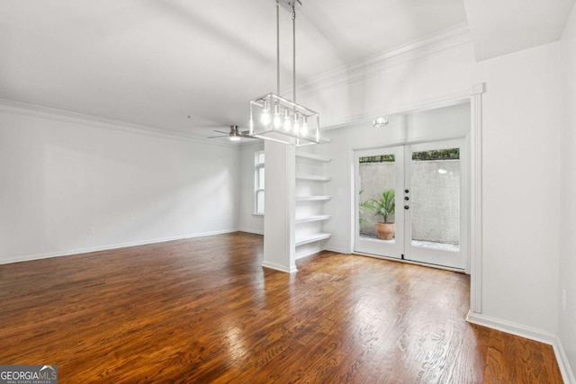 interior space with hardwood / wood-style floors, ceiling fan, french doors, ornamental molding, and built in shelves