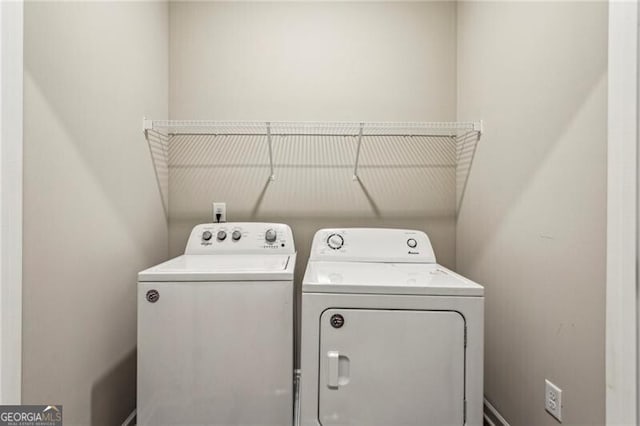 laundry room with separate washer and dryer